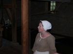 Dressed in costume educating visitors about 18th century commerce